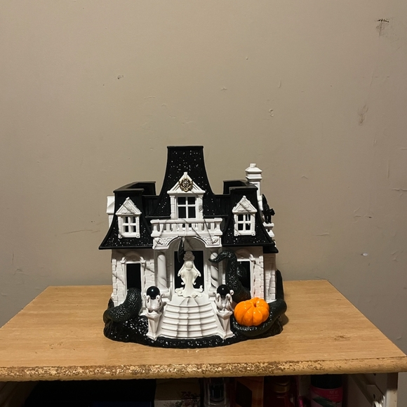 Black and White Haunted House Decor with Orange Pumpkin